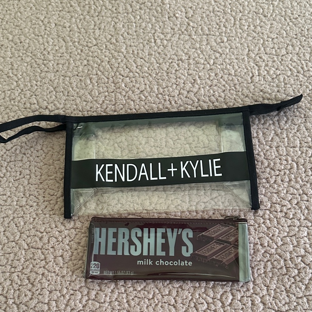 Kendall & Kylie Transparent Pouch with Black Trim and a hersheys pouch